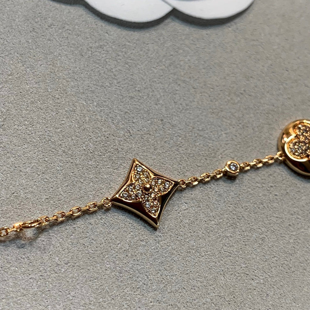 ??MIRA?¡¥STAR AND SUN 4 MOTIFS GOLD DIAMONDS BRACELET