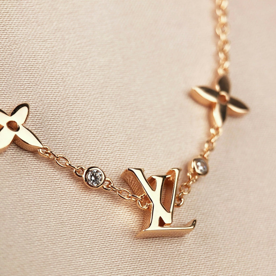 ??MIRA?¡¥STAR AND SUN 7 MOTIFS GOLD BRACELET