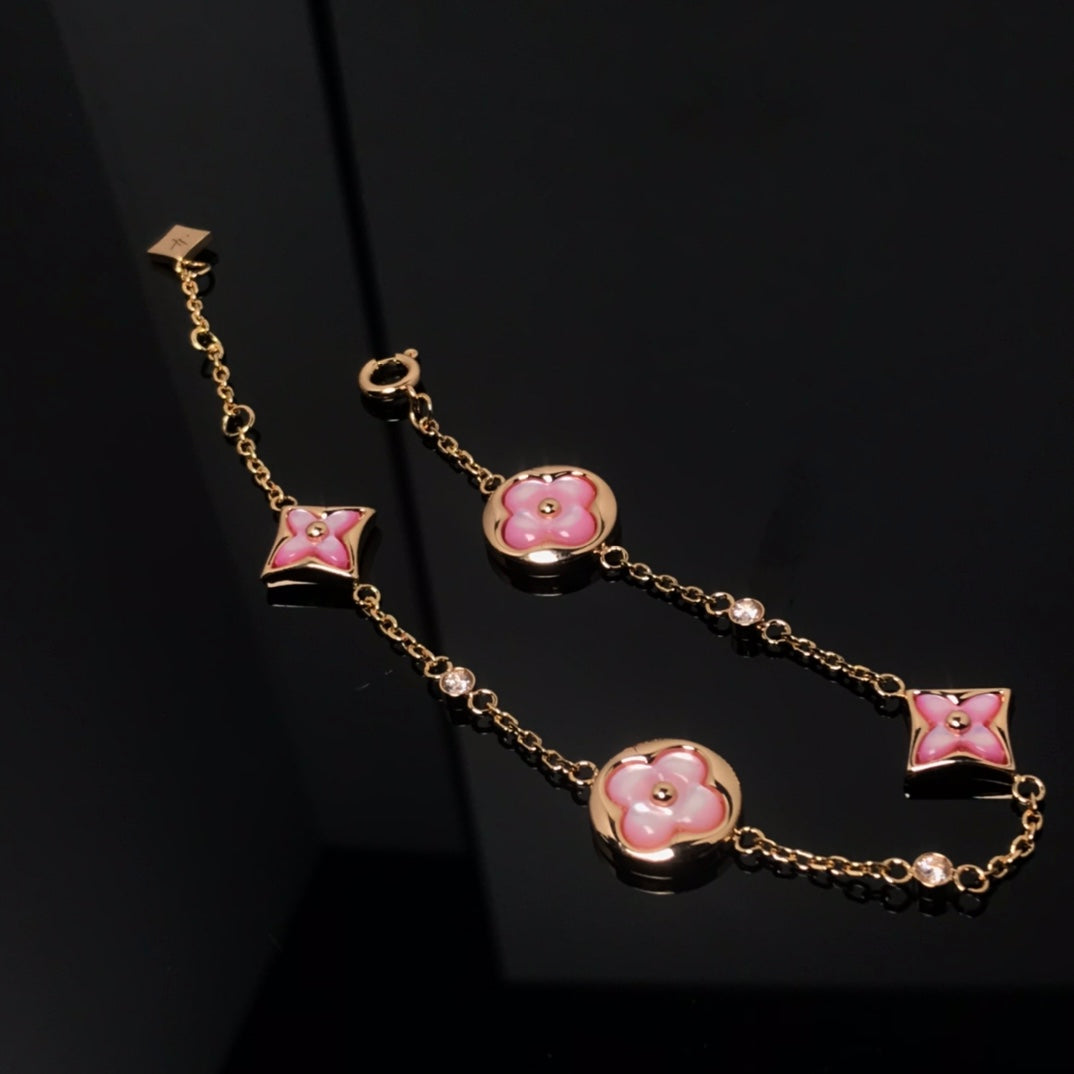 ??MIRA?¡¥STAR AND SUN 4 MOTIF PINK MOP PINK GOLD BRACELET
