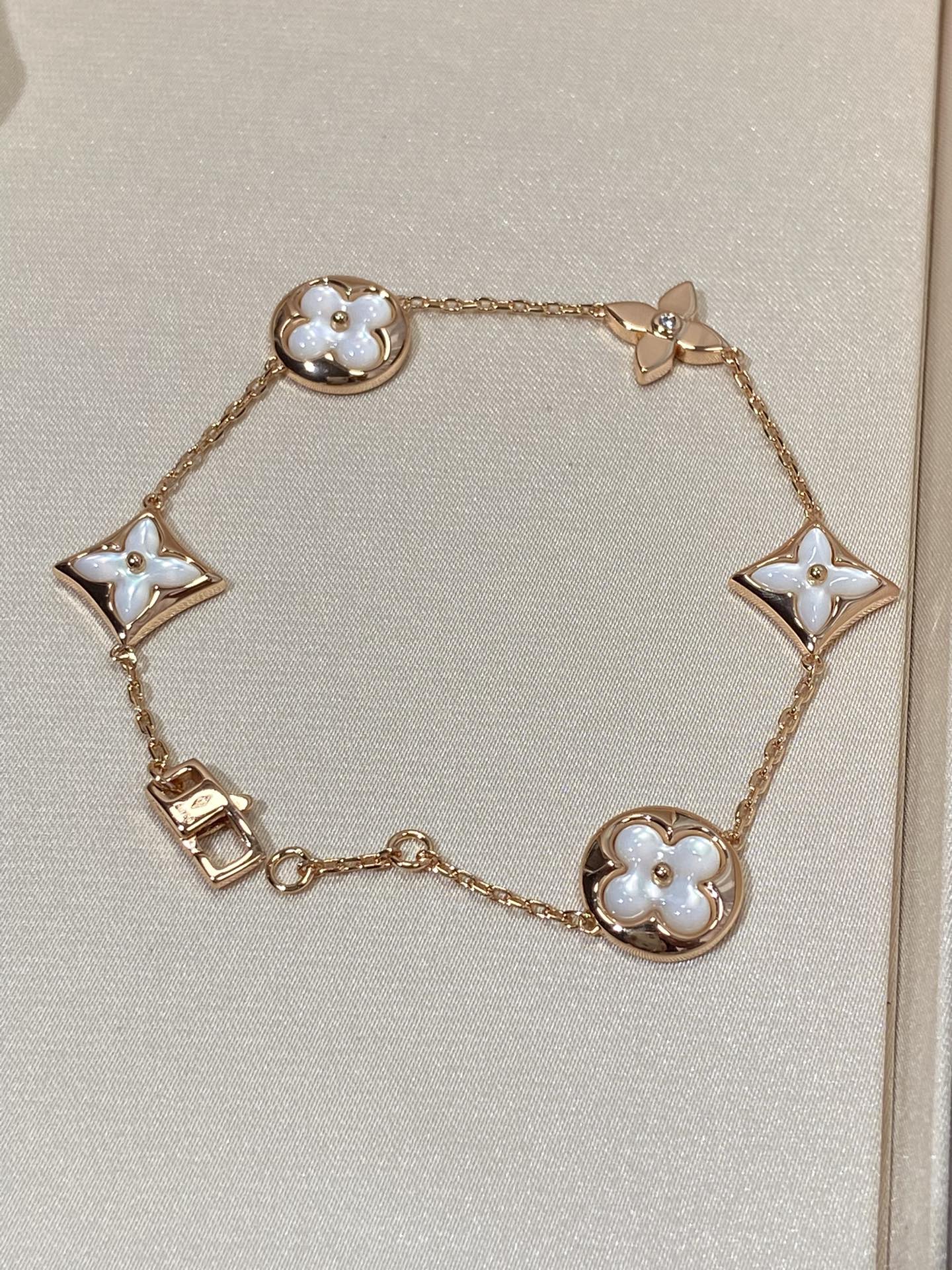 ??MIRA?¡¥STAR AND SUN 5 MOTIF MOP PINK GOLD BRACELET