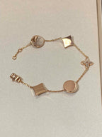 ??MIRA?¡¥STAR AND SUN 5 MOTIF MOP PINK GOLD BRACELET