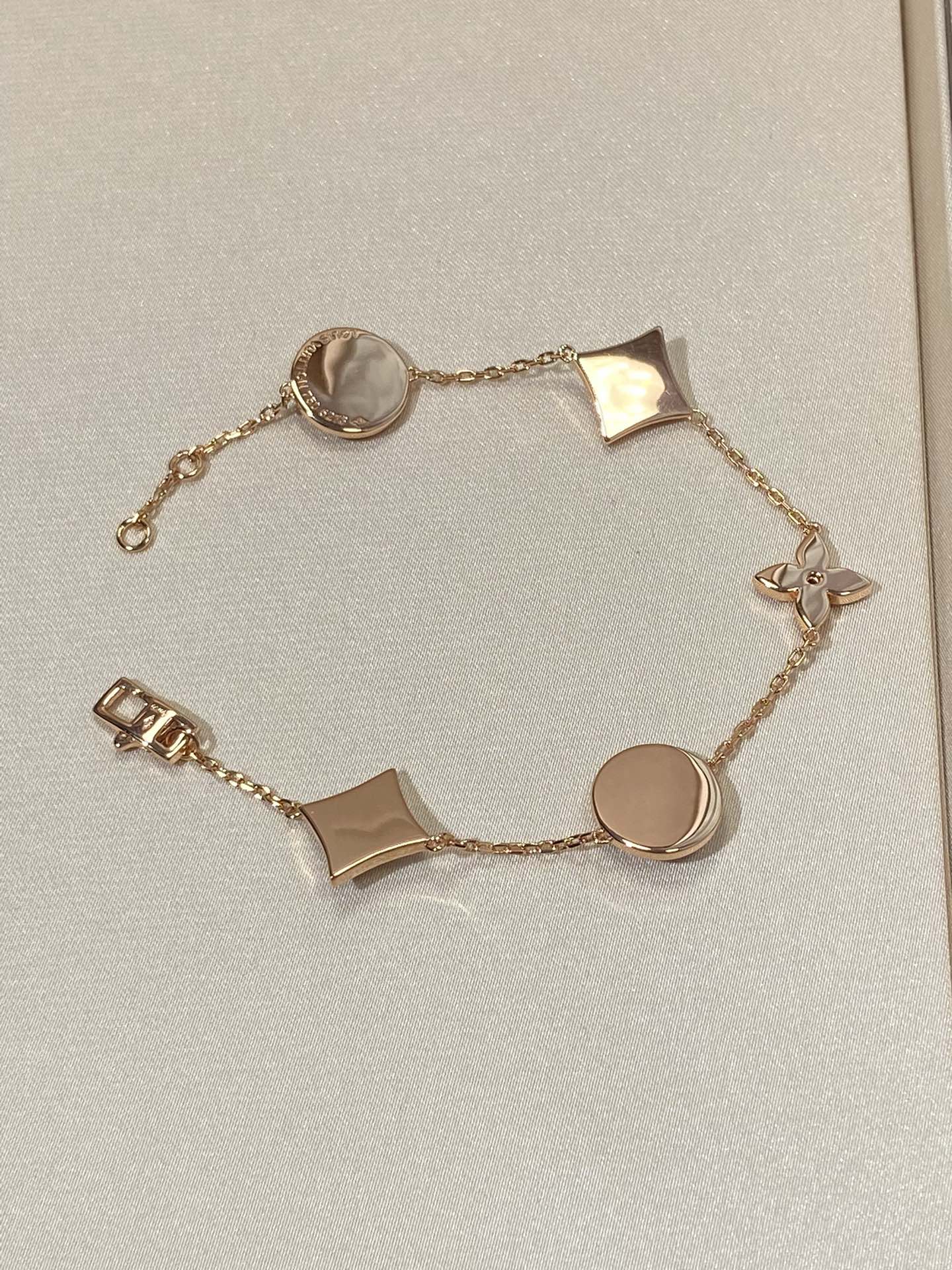 ??MIRA?¡¥STAR AND SUN 5 MOTIF MOP PINK GOLD BRACELET