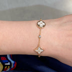 ??MIRA?¡¥STAR AND SUN 4 MOTIF WHITE MOP PINK GOLD BRACELET