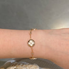 ??MIRA?¡¥STAR AND SUN 4 MOTIF WHITE MOP PINK GOLD BRACELET