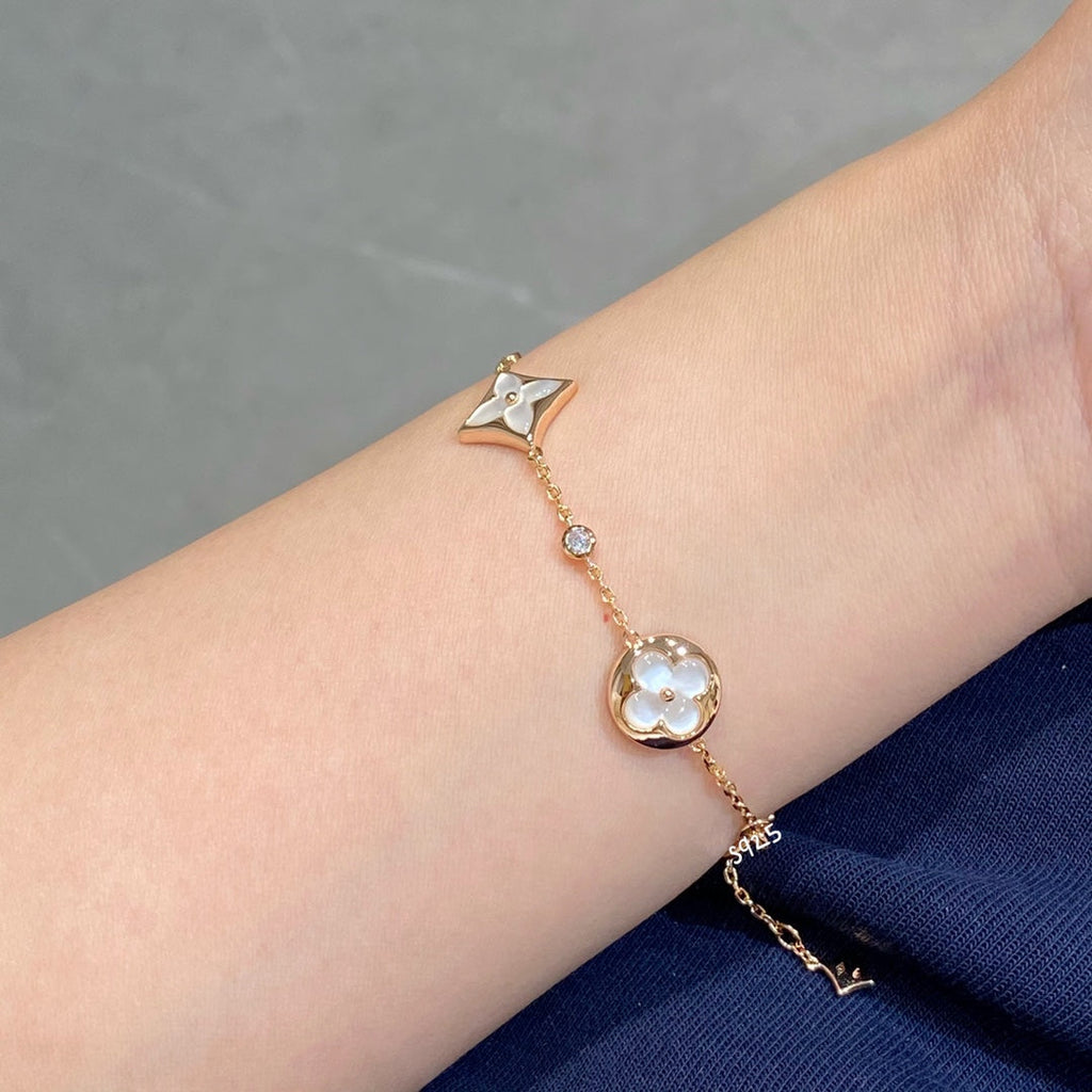 ??MIRA?¡¥STAR AND SUN 4 MOTIF WHITE MOP PINK GOLD BRACELET