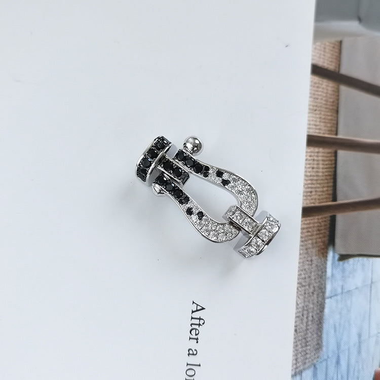 ??MIRA?¡¥FORCE LARGE HORSESHOE BLACK WHITE DIAMOND BRACELET SILVER