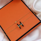 ??MIRA?¡¥HM CLIC BLACK ENAMEL GOLD NECKLACE